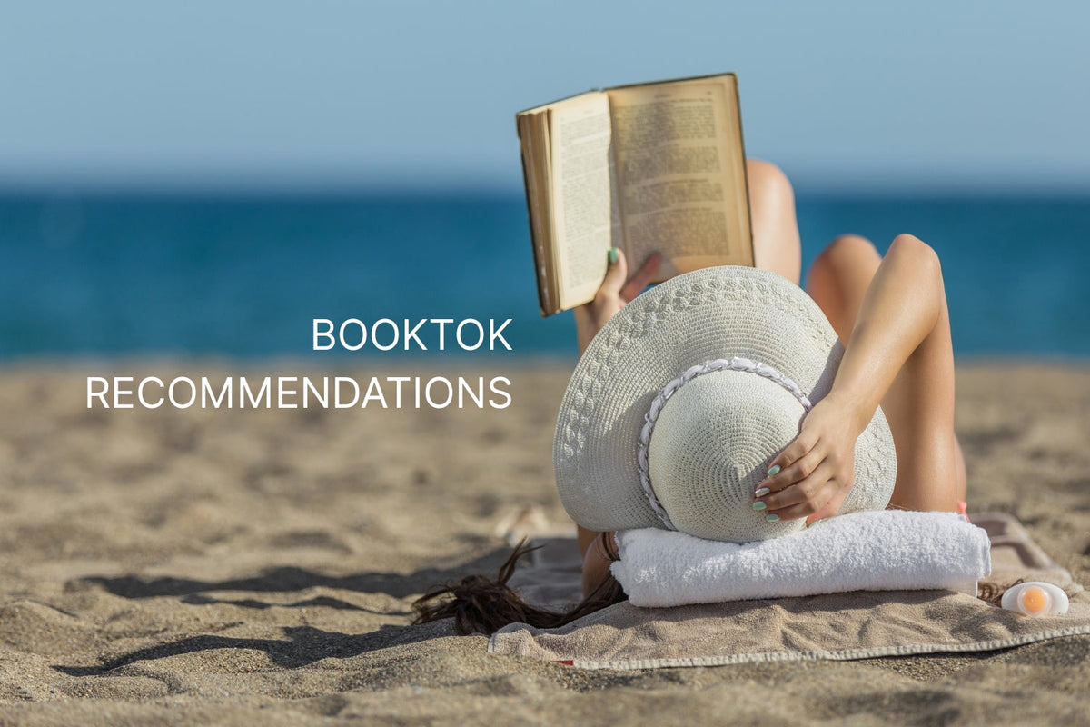 a woman reading on the beach - booktok recommendations